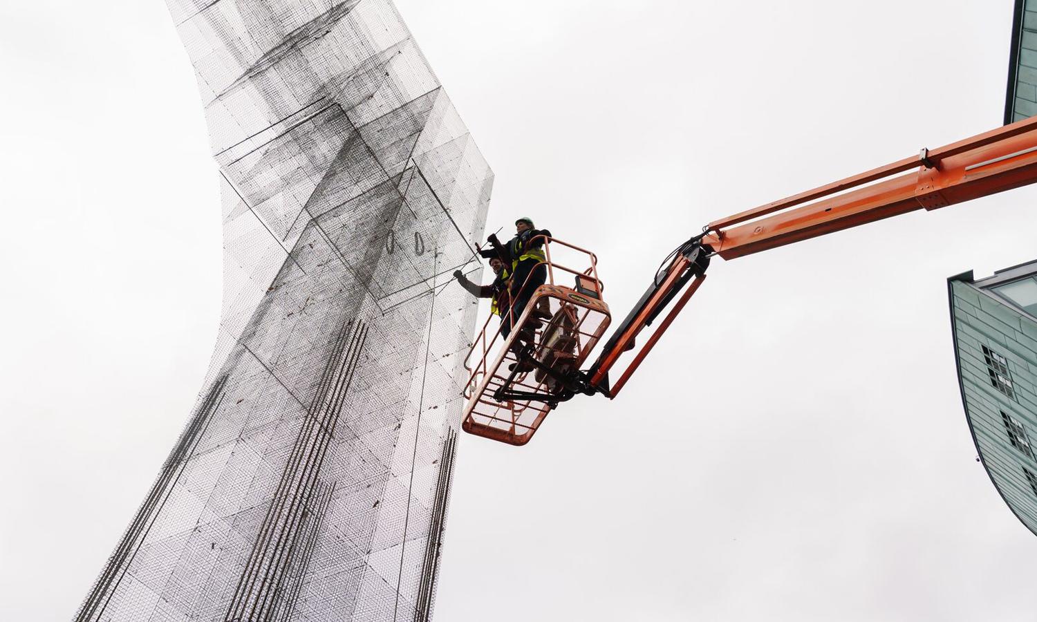 The build-up of a 13m tall artwork from a cherrypicker. 
