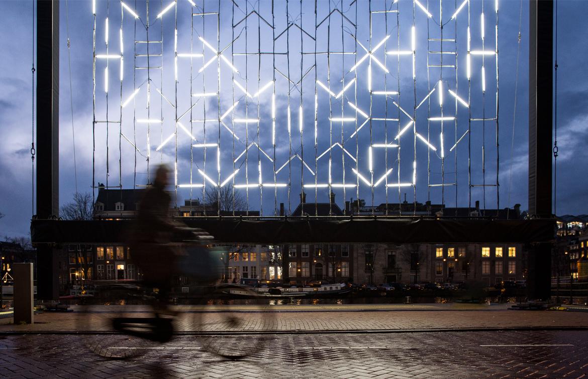 The picture shows the artwork Myth by Ben Zamora, placed at the pier at the Amstel in front of the Hermitage museum.